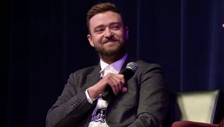 Justin Timberlake sitting on stage