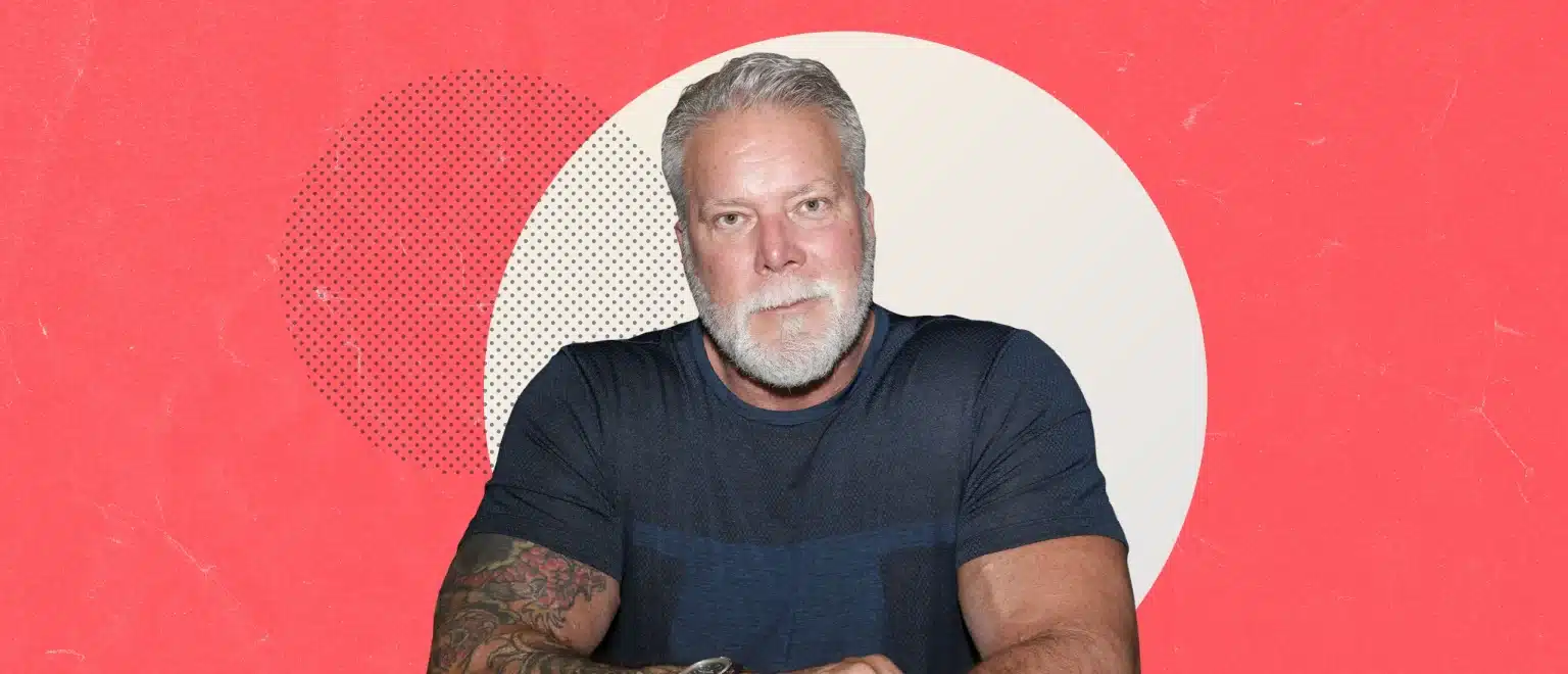 Kevin Nash on red and beige background