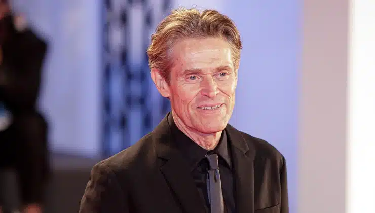 Willem Dafoe posing for pictures