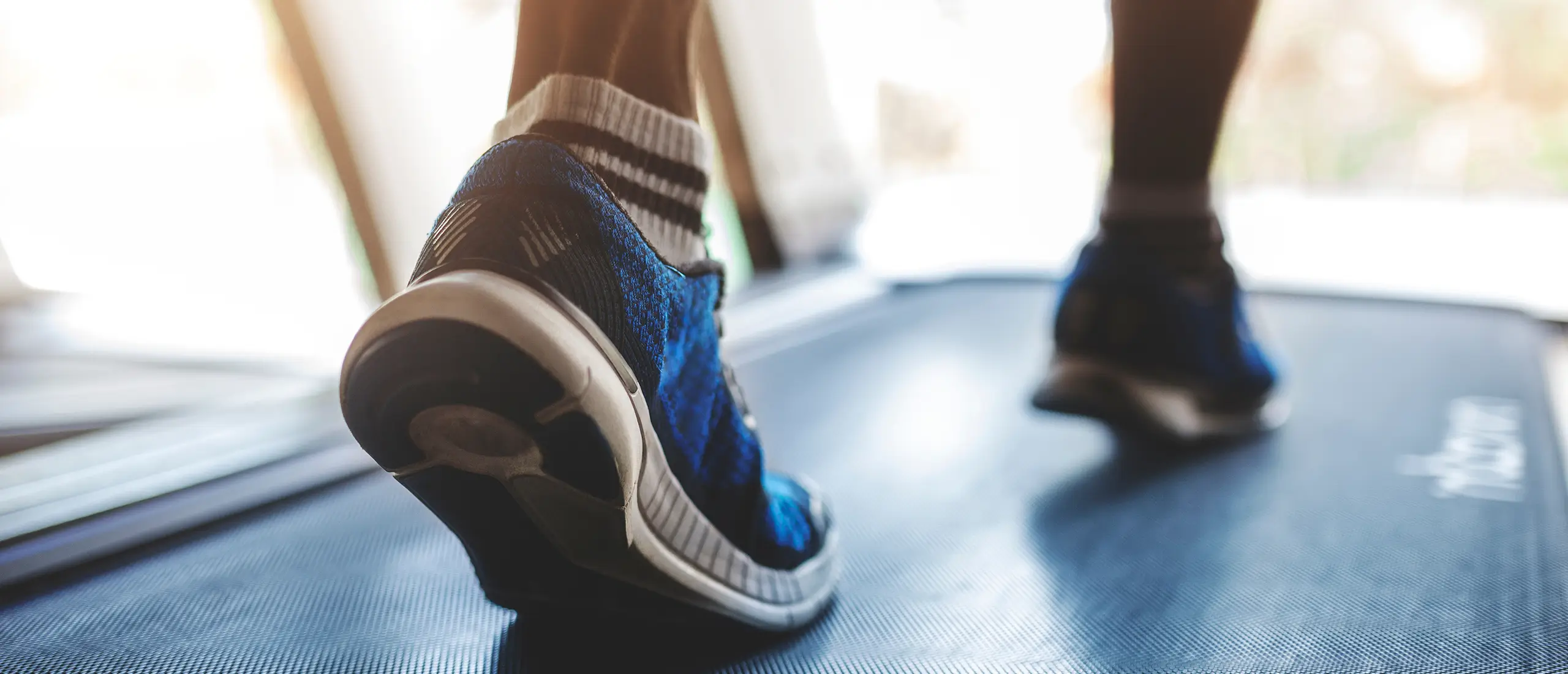Feet in motion on a treadmill
