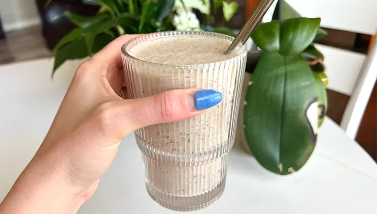 Tom Brady's peanut butter cup smoothie in a cup with a straw. 