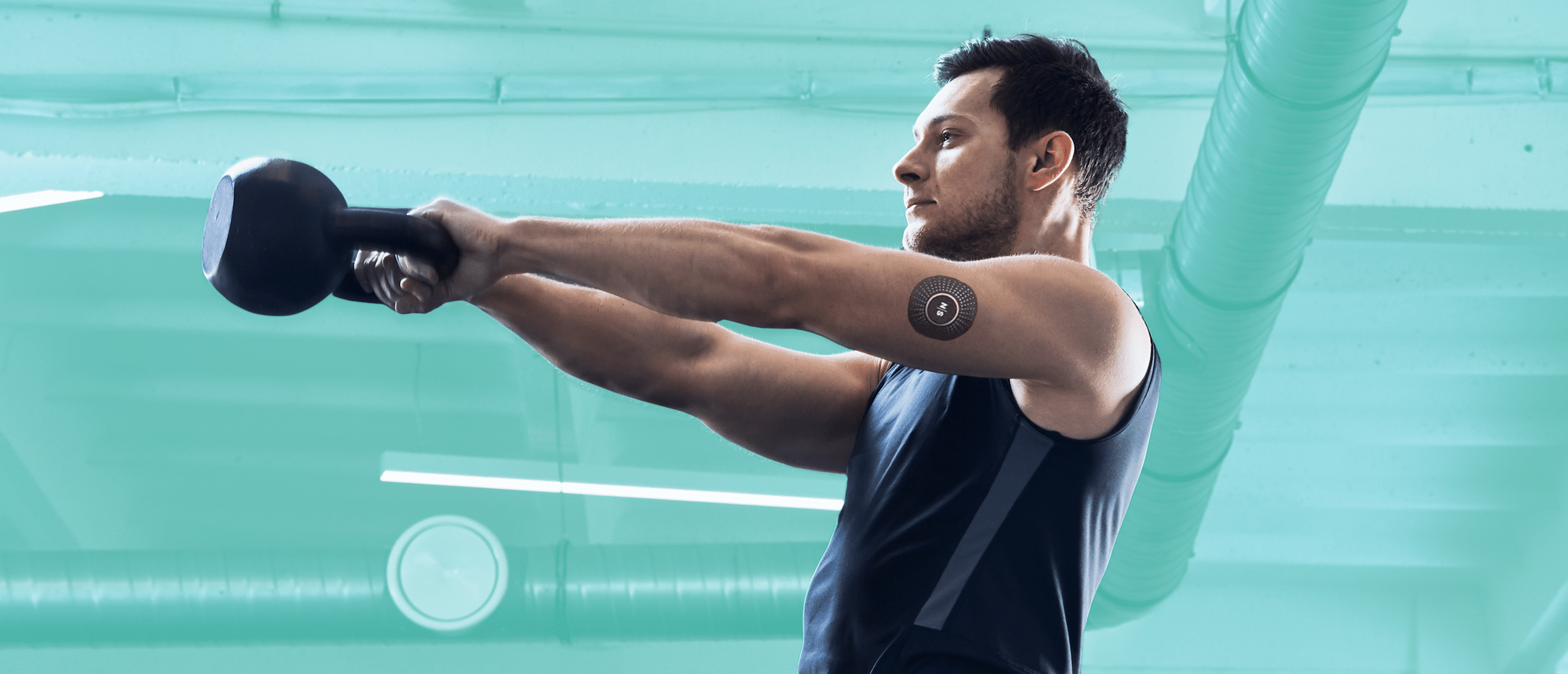 Man swinging kettlebell and wearing a nutrisense blood glucose monitor