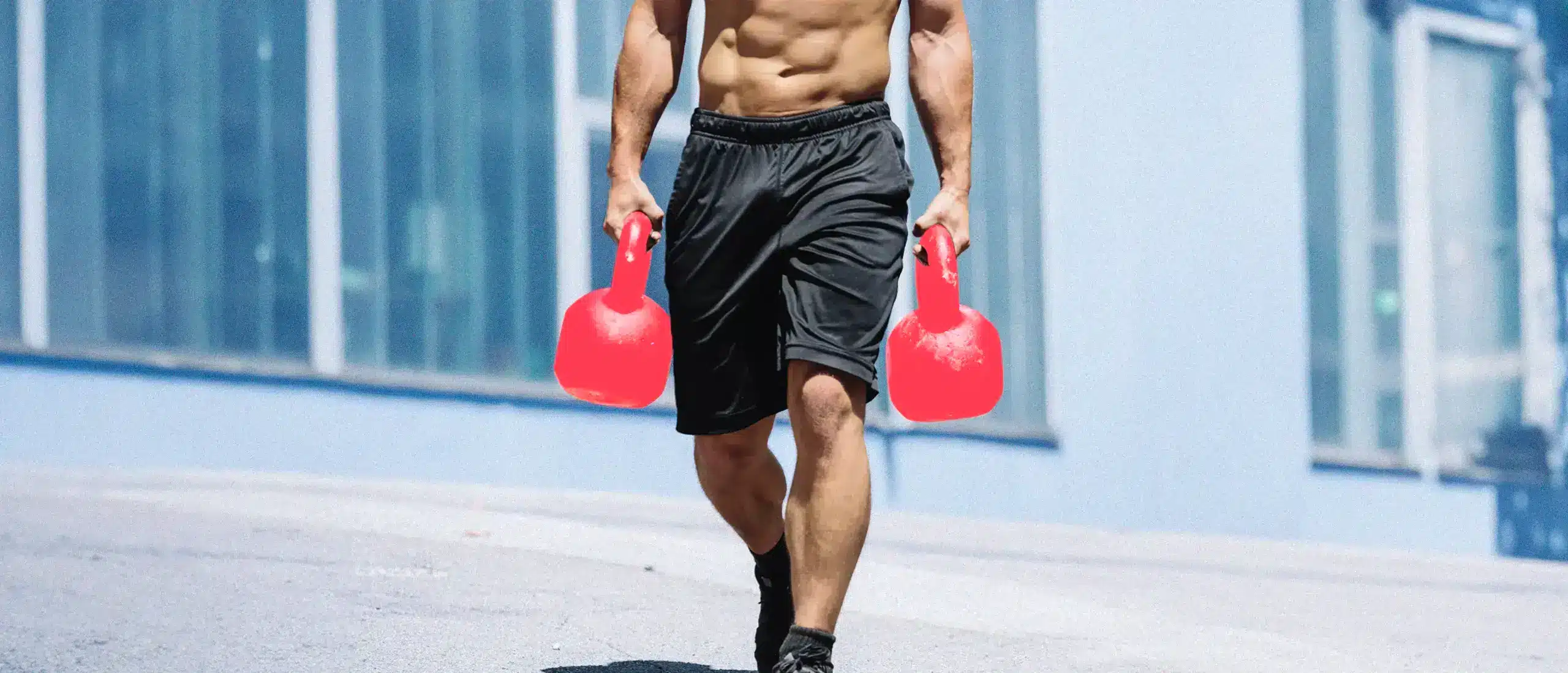 Man carrying two dumbbells
