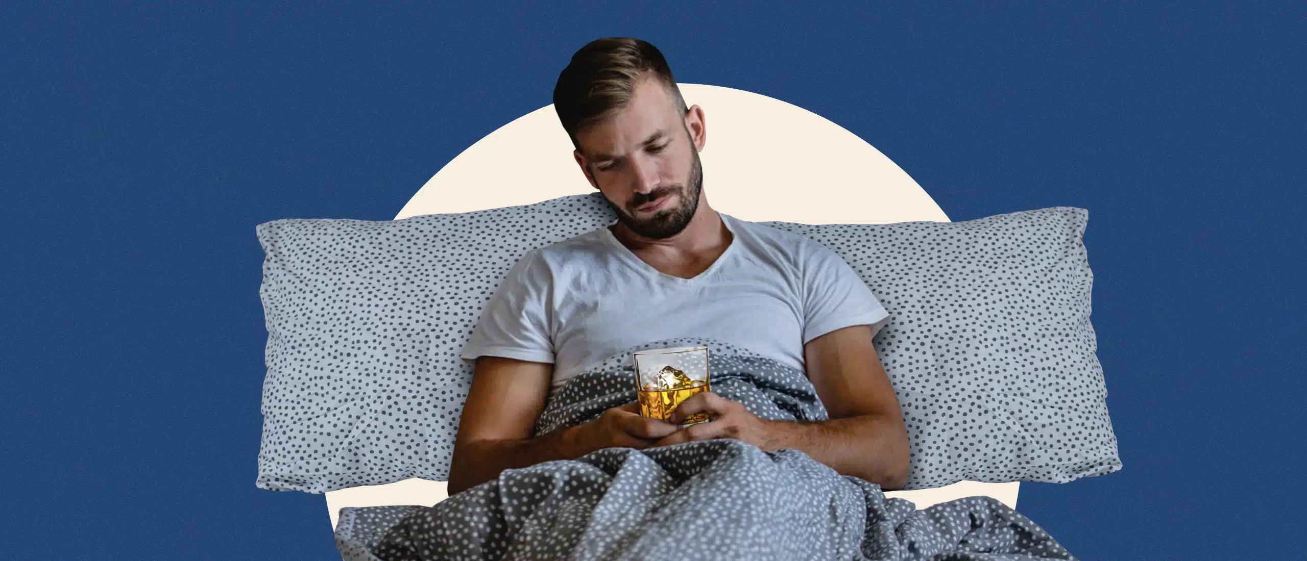 Man drinking in bed