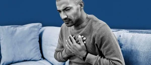 A man grabbing chest in pain