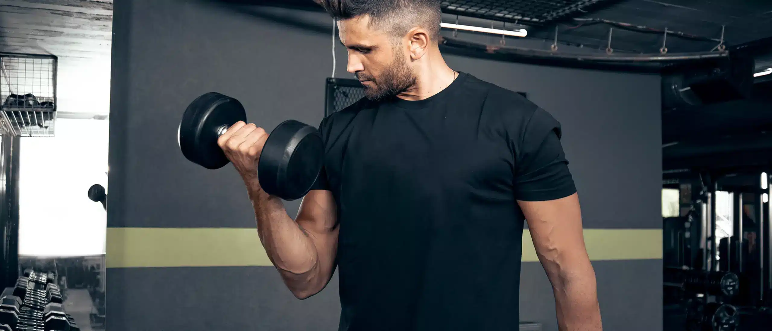 Man doing a bicep curl with a dumbell