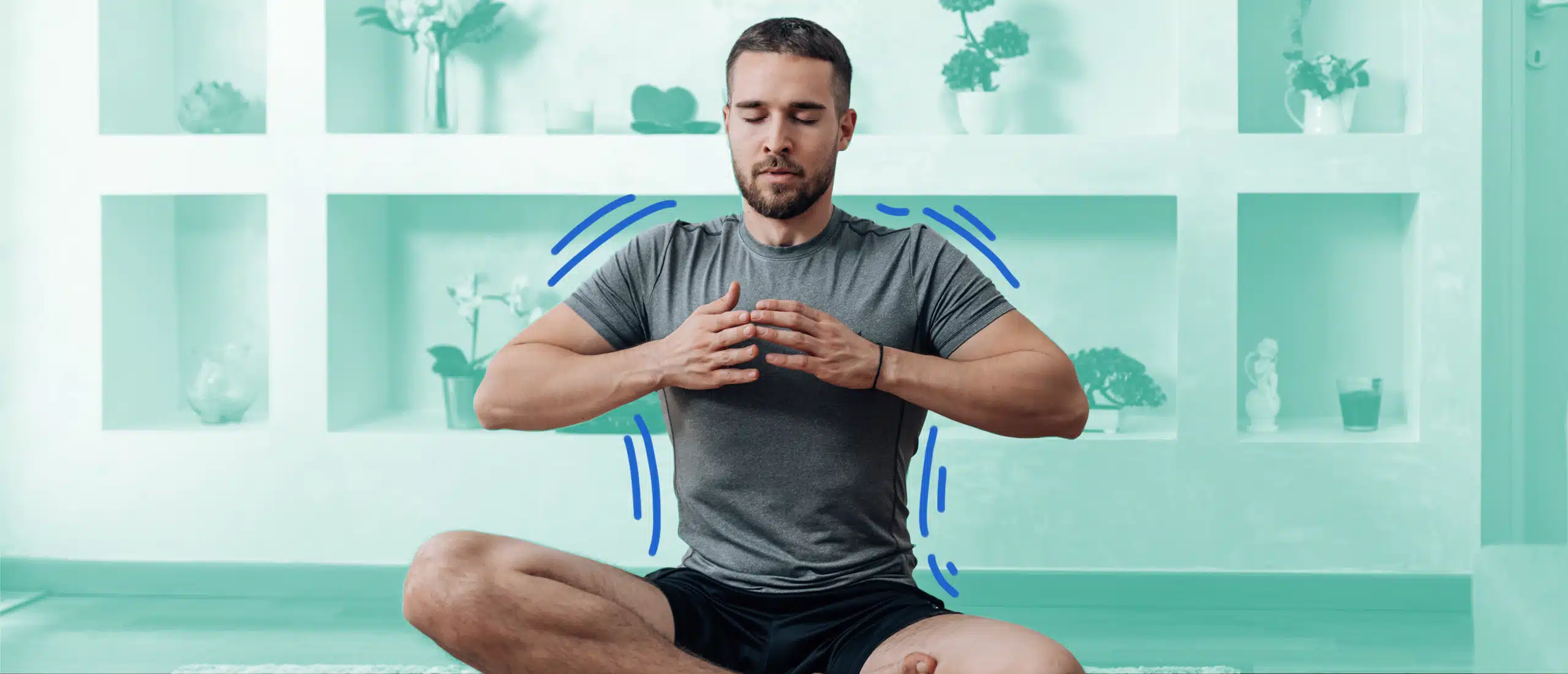 Man sitting in a butterfly position with his hands on his chest and eyes closed with blue lines around him to show that he's taking a deep breath