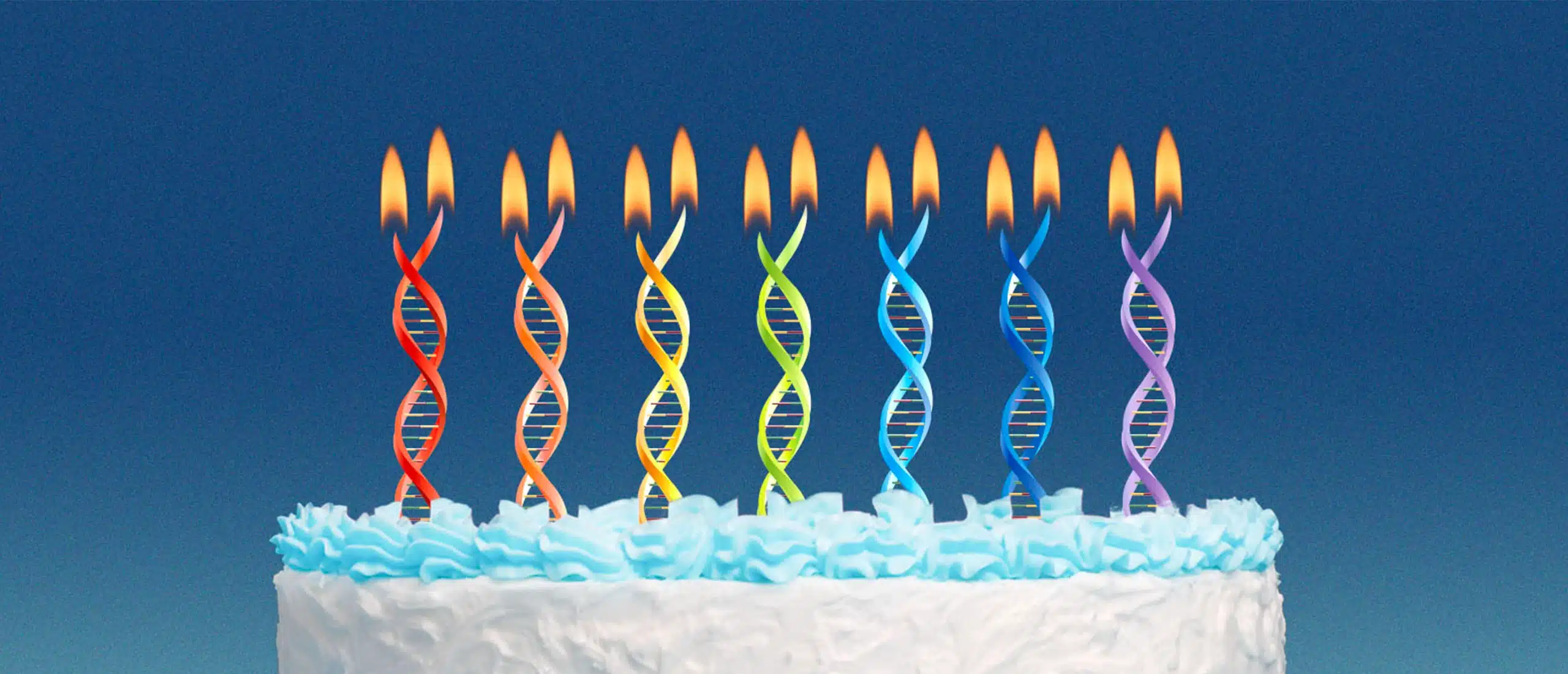 Birthday cake with dna candles on kitchen table