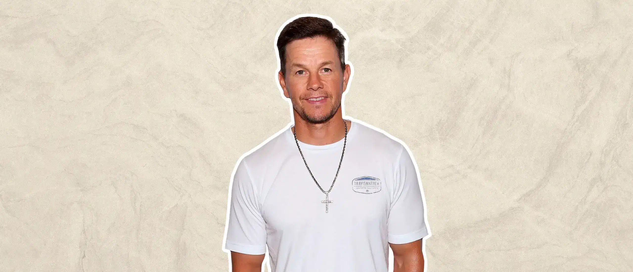 Mark Wahlberg psing in front of textured background