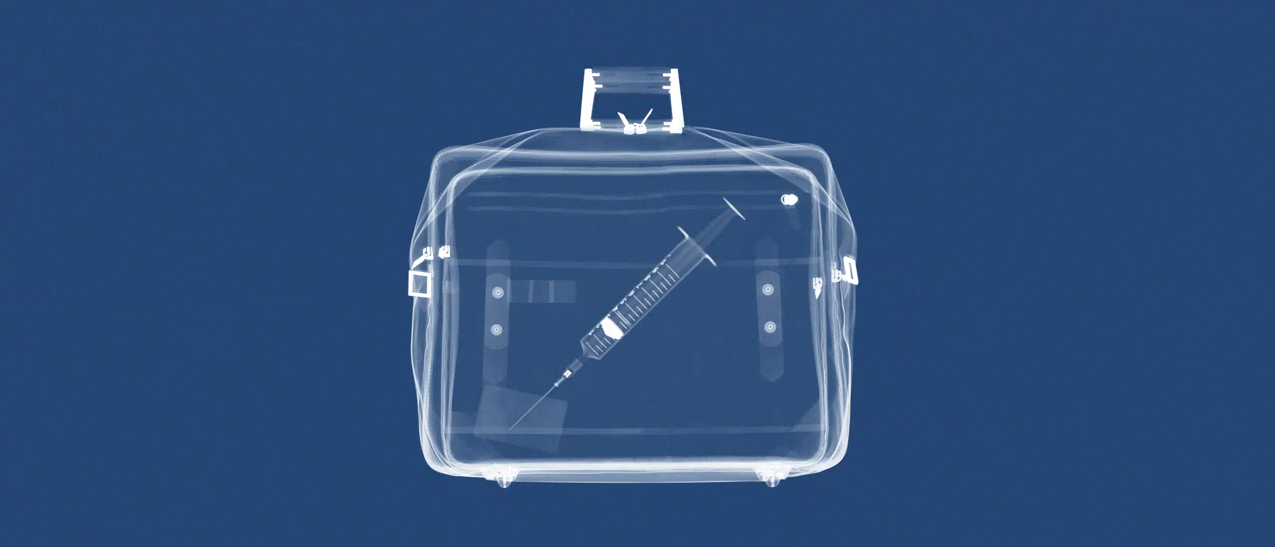 syringe in a briefcase under an x-ray