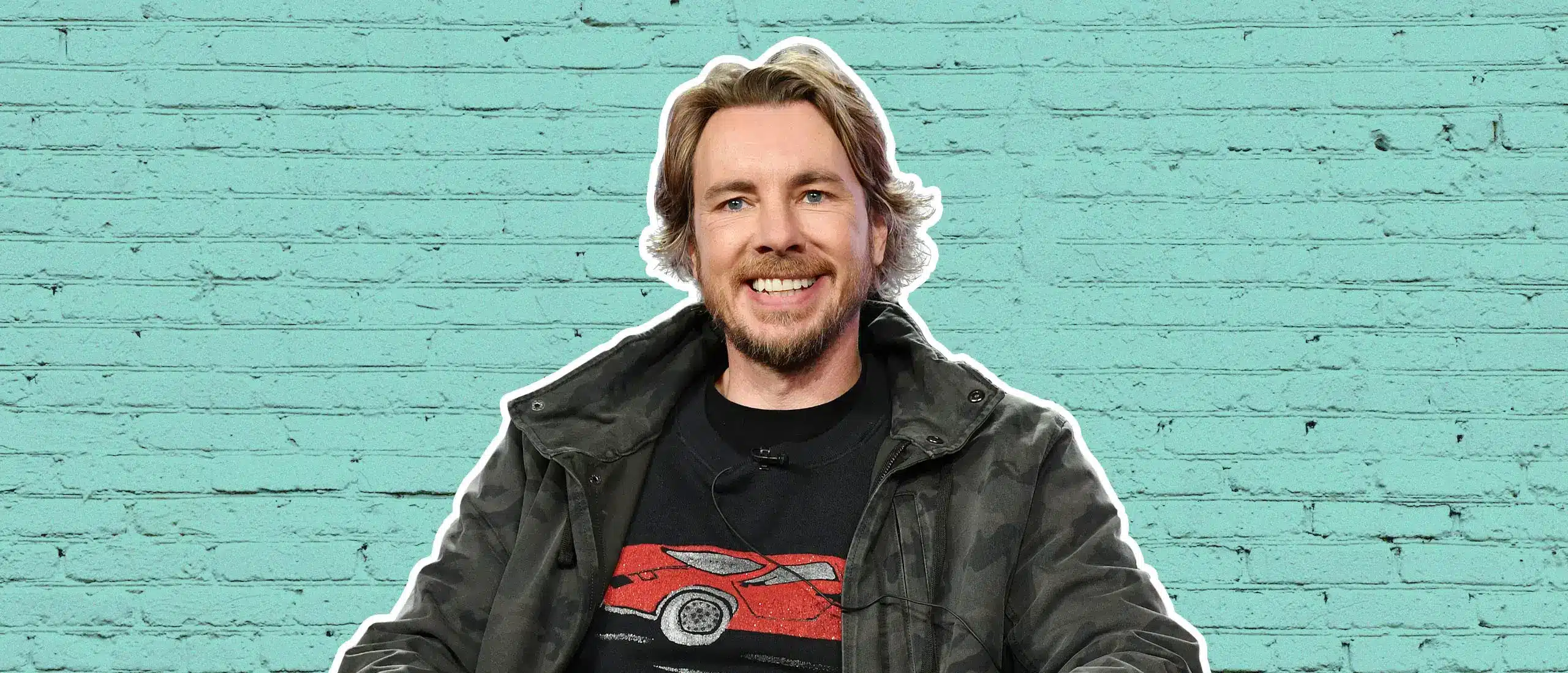 dax shepard sitting in front of green brick background