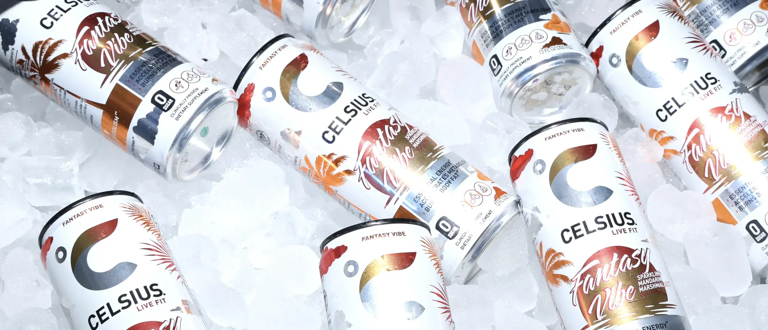 several celsius energy drinks scattered across a bed of ice