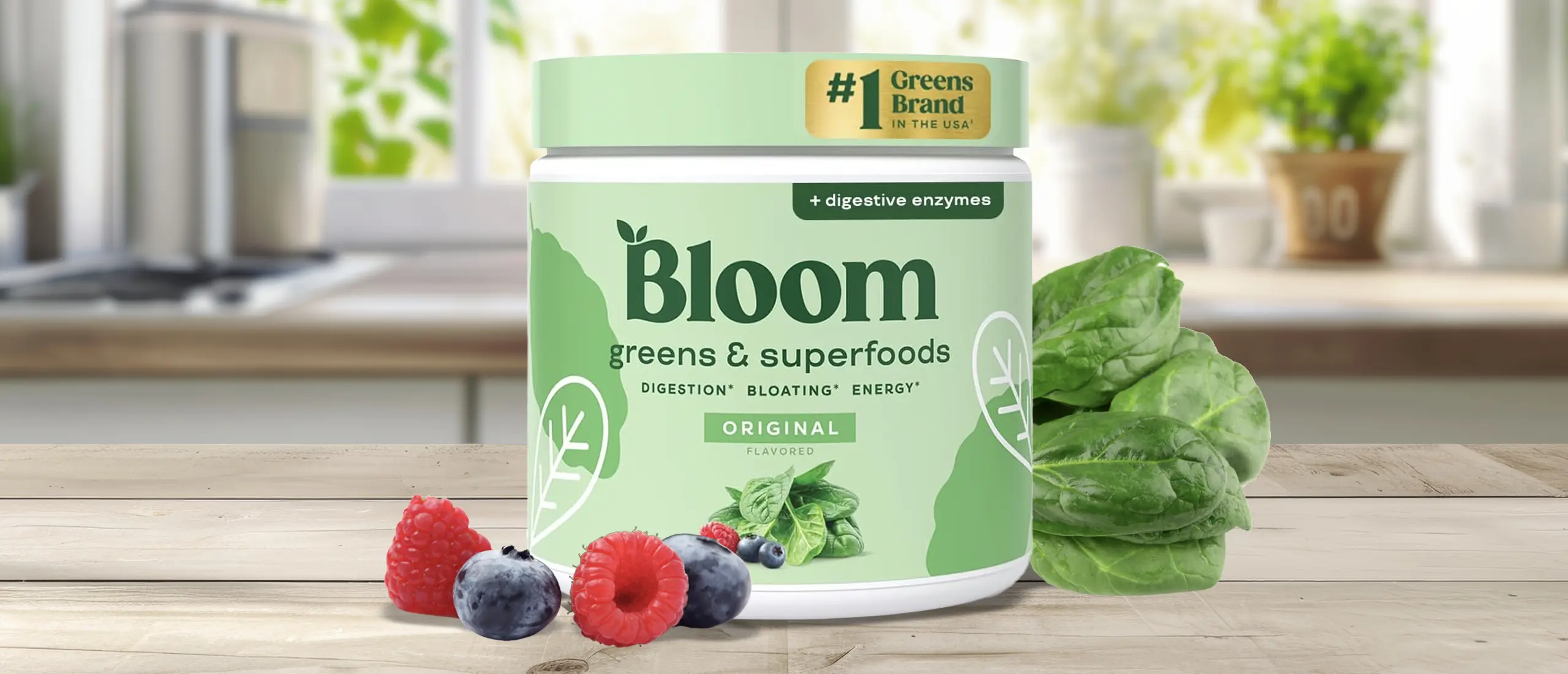 A container of Bloom Greens on a blue and tan background